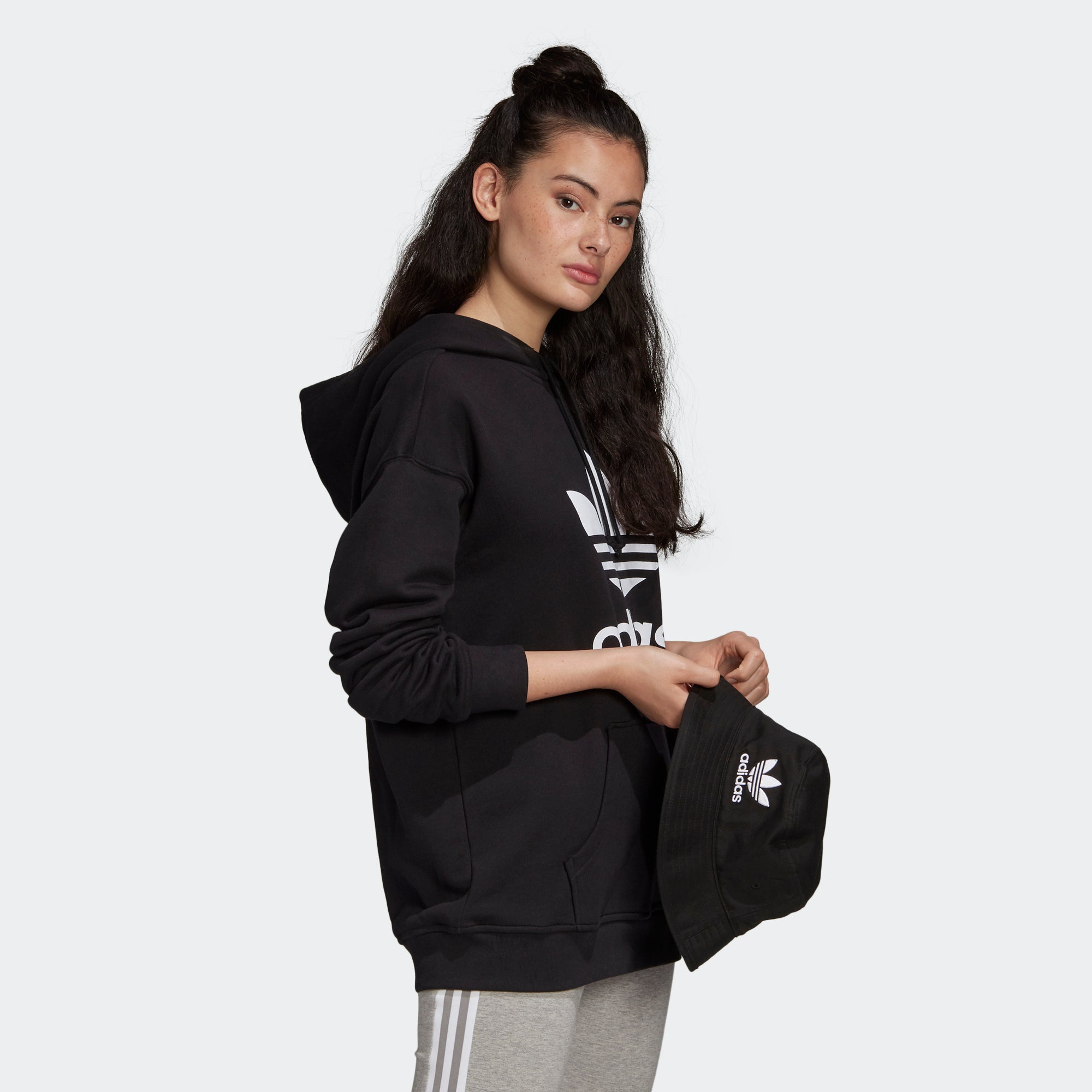 Women's adidas Originals Adicolor Trefoil Hoodie Black (SKU FM3307) | Chicago City Sports | angled view on model