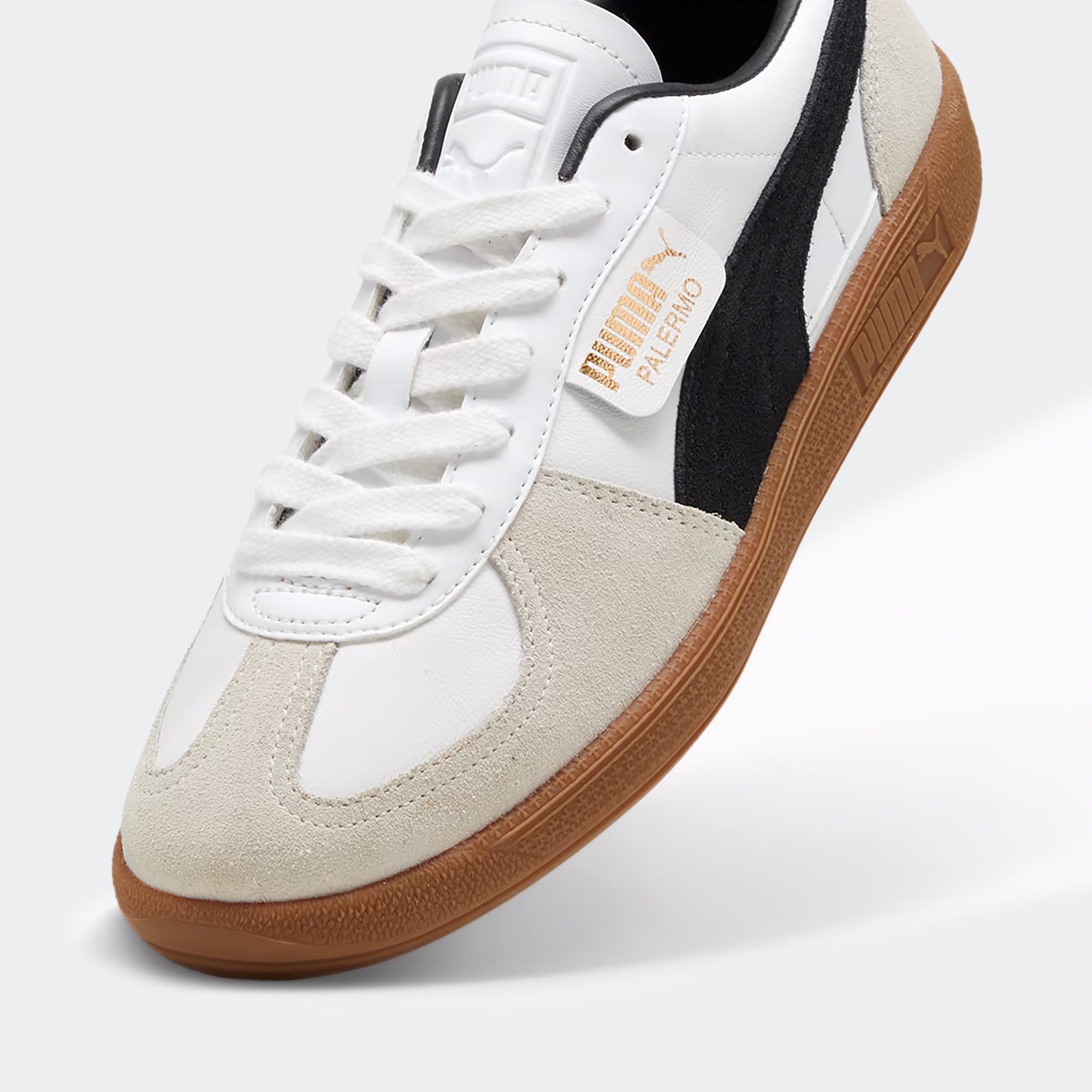 PUMA Palermo Leather sneakers in black and white