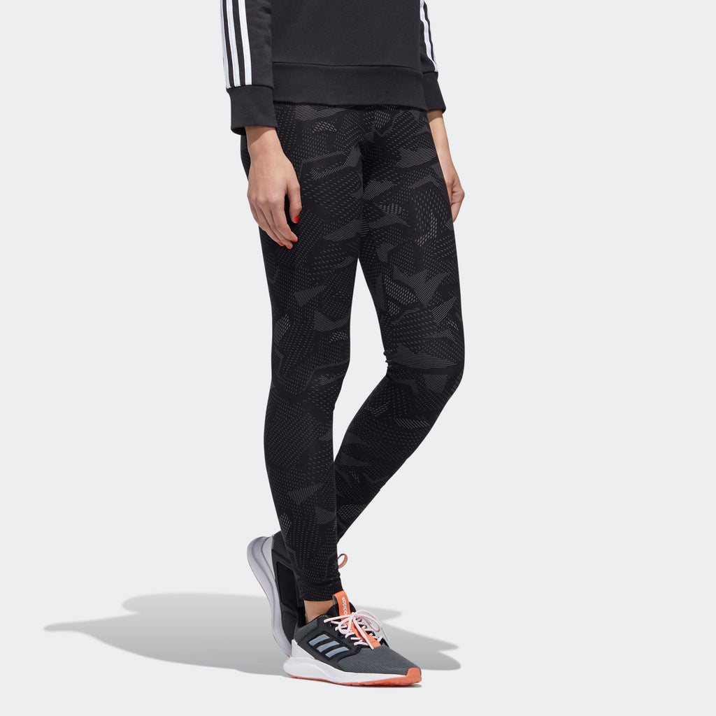 Women's adidas Essentials Allover Print Leggings Black GE1140 | Chicago City Sports | angled view on model